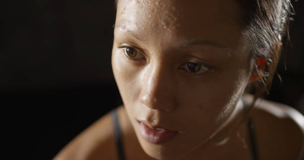 istock Close up of Athletic woman sweating taking a break after work out 1091032620