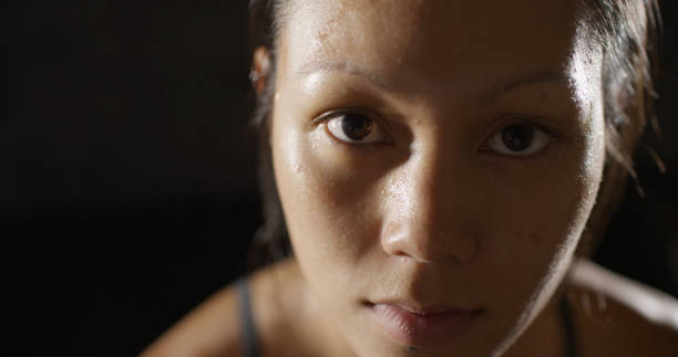 istock Portrait of athletic woman sweating taking a break from workout 1091032636