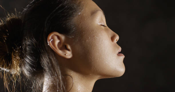 istock Fitness woman sweating taking a breath after working out 1091032646
