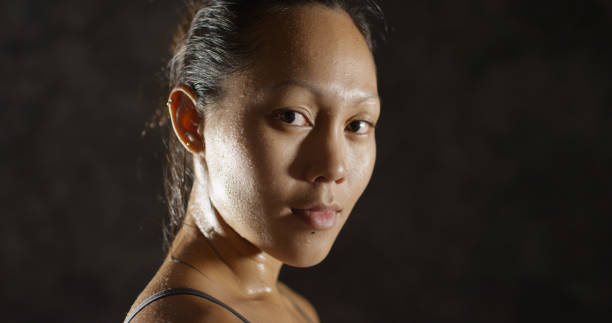 istock Fitness woman sweating taking a breath after working out 1091032676
