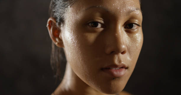 istock Young sports woman's face sweating from exercise 1091032684