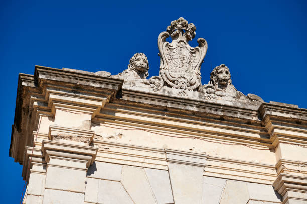animal representation bas-relief on top of an arched gate of an old building in Italy