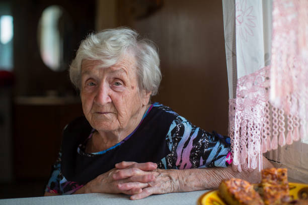 Portrait of an elderly woman has Breakfast sitting at home. Portrait of an elderly woman has Breakfast sitting at home. grandma portrait stock pictures, royalty-free photos & images