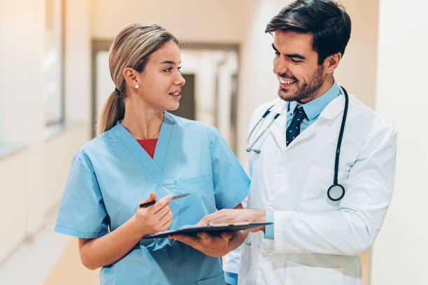 istock Doctor and nurse discussing medical chart 1091058052