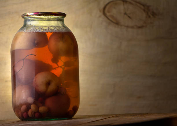 Kalamata olives, pickled whole, large and dark purple table olives, in a glass jar with screw cap. Olive variety from Kalamata region in Greece. Hand-picked ripe fruits with pit, preserved in a brine.