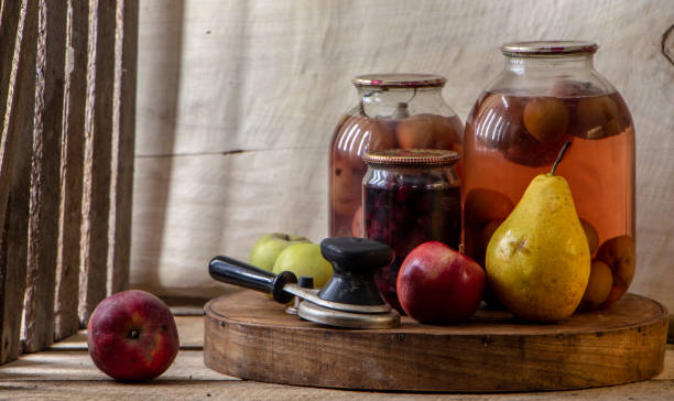 istock Home-made canned compote and fresh fruit on the basement shelf still life 1091060998