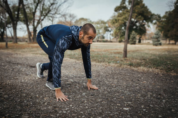 istock Handsome male athlete running in the public park 1091068472