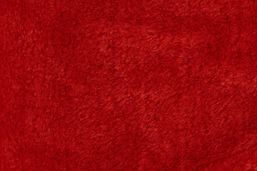 Red fur texture background. Wool soft cotton surface