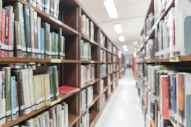 istock Blur school library or study room with book shelves for education background 1091081264