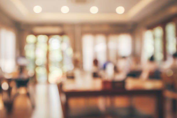 istock Restaurant interior with customer and wood table blur abstract background with bokeh light 1091082032
