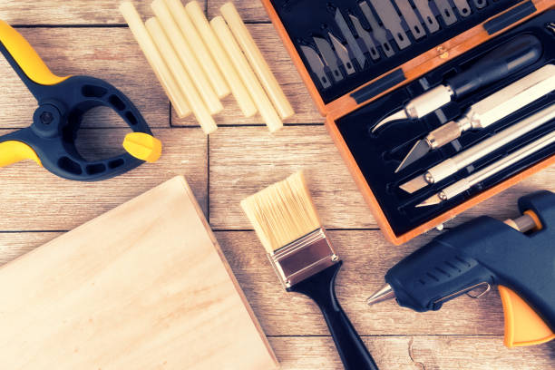 istock Set of DIY tools on a white wooden plank, directly above. 1091108864