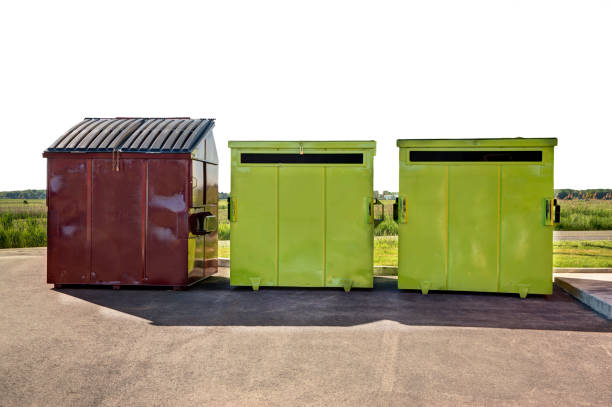istock Brown garbage container and green recycling containers in a commercial parking. 1091109130