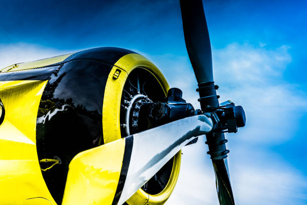 istock Propeller of a yellow plane on blue sky background 1091110562