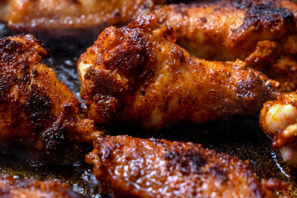 istock buffalo chicken wings frying in a pan 1091117300