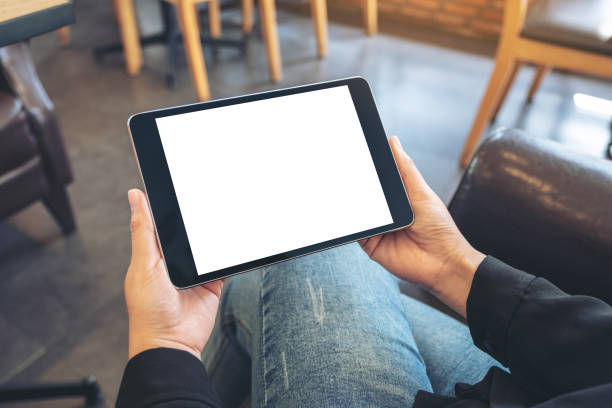 istock a woman holding black tablet pc with blank white screen 1091117922