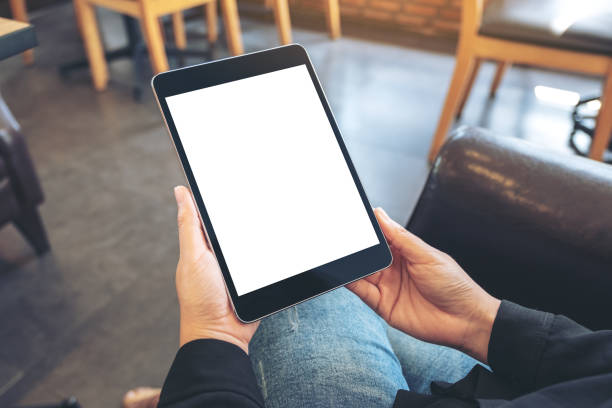 istock a woman holding black tablet pc with blank white screen 1091117938