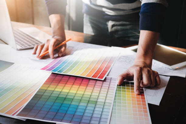 istock corporate designer graphic creative creativity concept ,man using pen, laptop and tablet to create graphic design coloring colour ideas style house to order customer. 1091131888