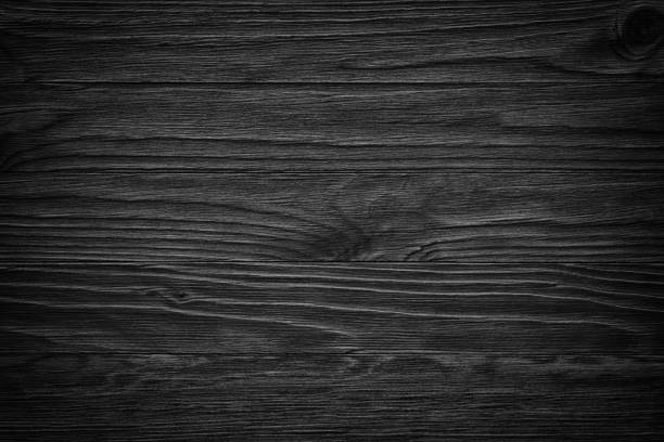 Old black wooden background.Blackboard.  gloomy wood texture black wooden background or gloomy wood grain texture wood grain stock pictures, royalty-free photos & images