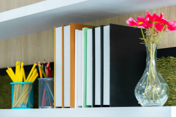 istock Classroom book shelf with books flower and pencil 1091150932