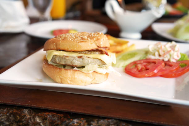 istock hamburger and tomato with salad in side 1091152558