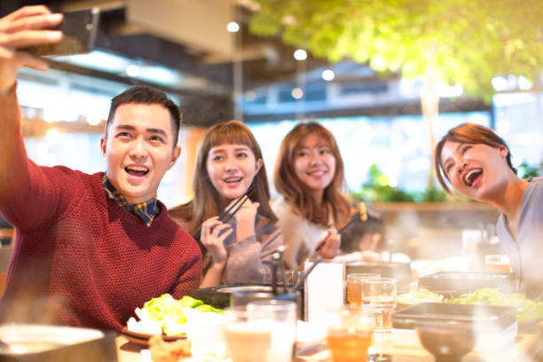 young Group  taking selfie in the restaurant