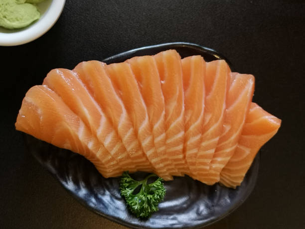 istock Close up slice of salmon sashimi 1091160990