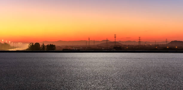istock Empty asphalt road and mountains at beautiful sunset 1091167238
