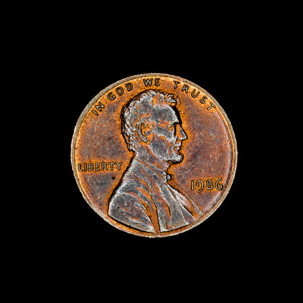 One american cent coin on black background