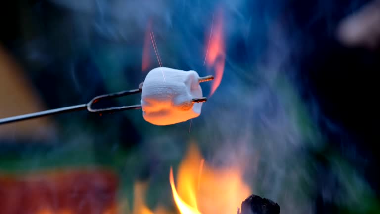 Melting marshmallows over a hot fire