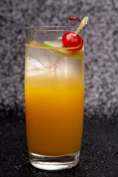 istock Orange cocktail drink In a clear glass on a black background 1091176574
