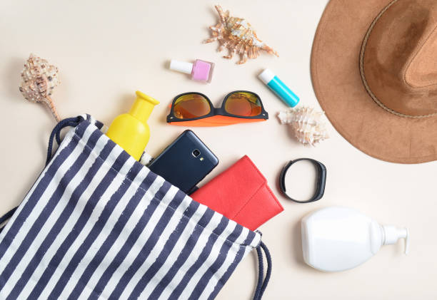 istock Beach bag and accessories for relaxing on the beach layout on white background. The concept of the resort at sea, summer time. Top view, flat lay, minimalism 1091184200