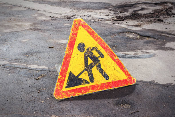 istock Works ahead warning sign on a road 1091187024