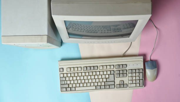 istock Retro stationary computer on colored background. Monitor, system unit, computer mouse. Obsolete Technologies, top view 1091188996