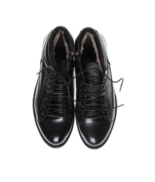 istock black men's shoes on a black isolated background 1091193124