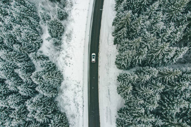 istock white suv overhead view road trip highway in snowed winter time 1091203532