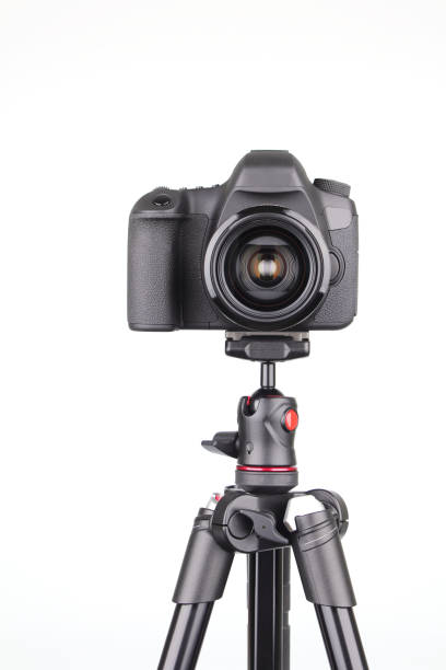 istock Black DSLR Camera on tripod isolated on white background 1091204738