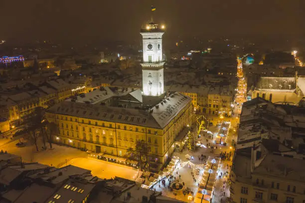 Photo of aerial view of capital building in center of european city at sunset in winter time