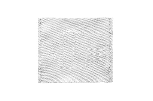 Blank white textile patch isolated over white