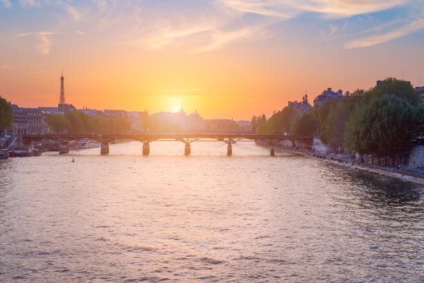 istock Paris skyline at sunset with river Seine in the foreground 1091210034