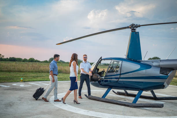 istock Chopper pilot opening helicopter door for passengers 1091215900