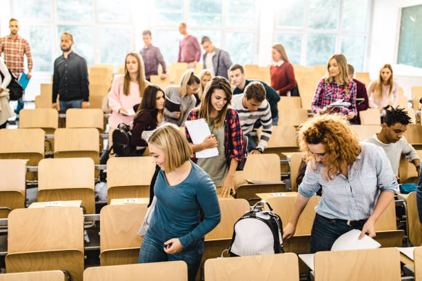 istock Large group of university students leaving the lecture hall. 1091220278