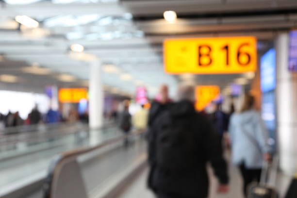 istock Defocused airport passengers crowd walking blurred people 1091221920