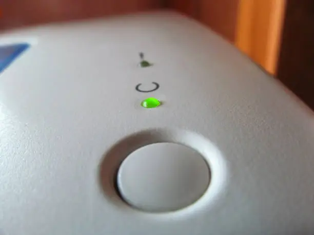 Photo of The green light on the white case indicates that the printer is on