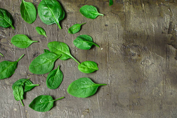 istock spinach (green grass). top food background 1091226874