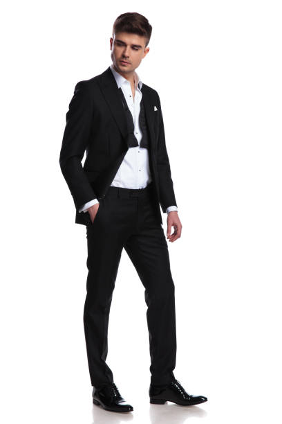 istock handsome groom with hand in pocket looks down to side 1091233146