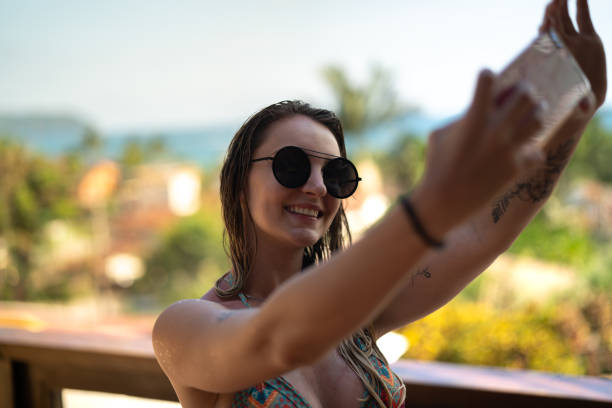 istock Girl taking a selfie at beach house 1091234172