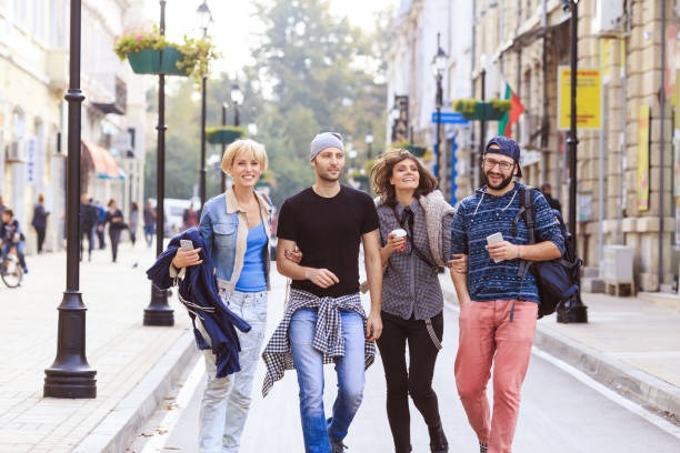 istock Cheerful friends walking on street 1091234404