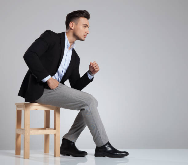 istock side view of seated businessman resting elbow on knee 1091236058