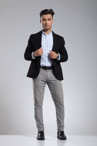 istock handsome smart casual man in black suit standing 1091236364