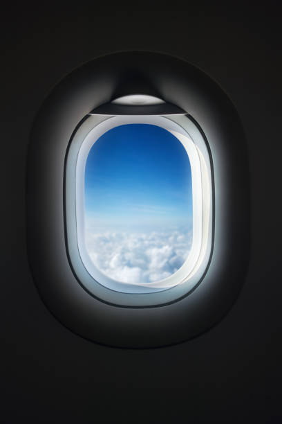 airplane window in flight - airplane porthole imagens e fotografias de stock